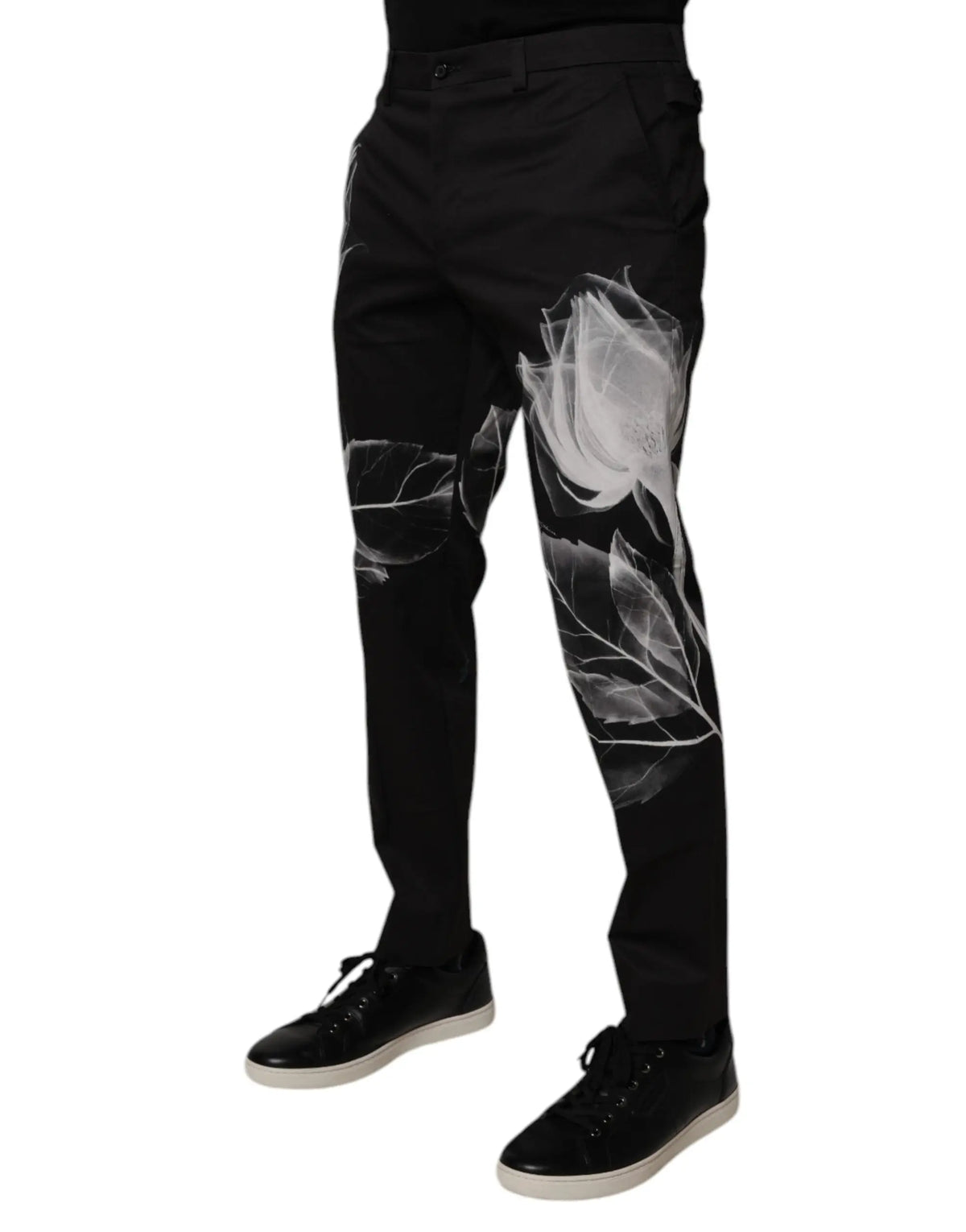 Pantalon slim en coton noir dolce gabbana avec motif floral blanc et motifs translucides de roses et feuilles le long des jambes