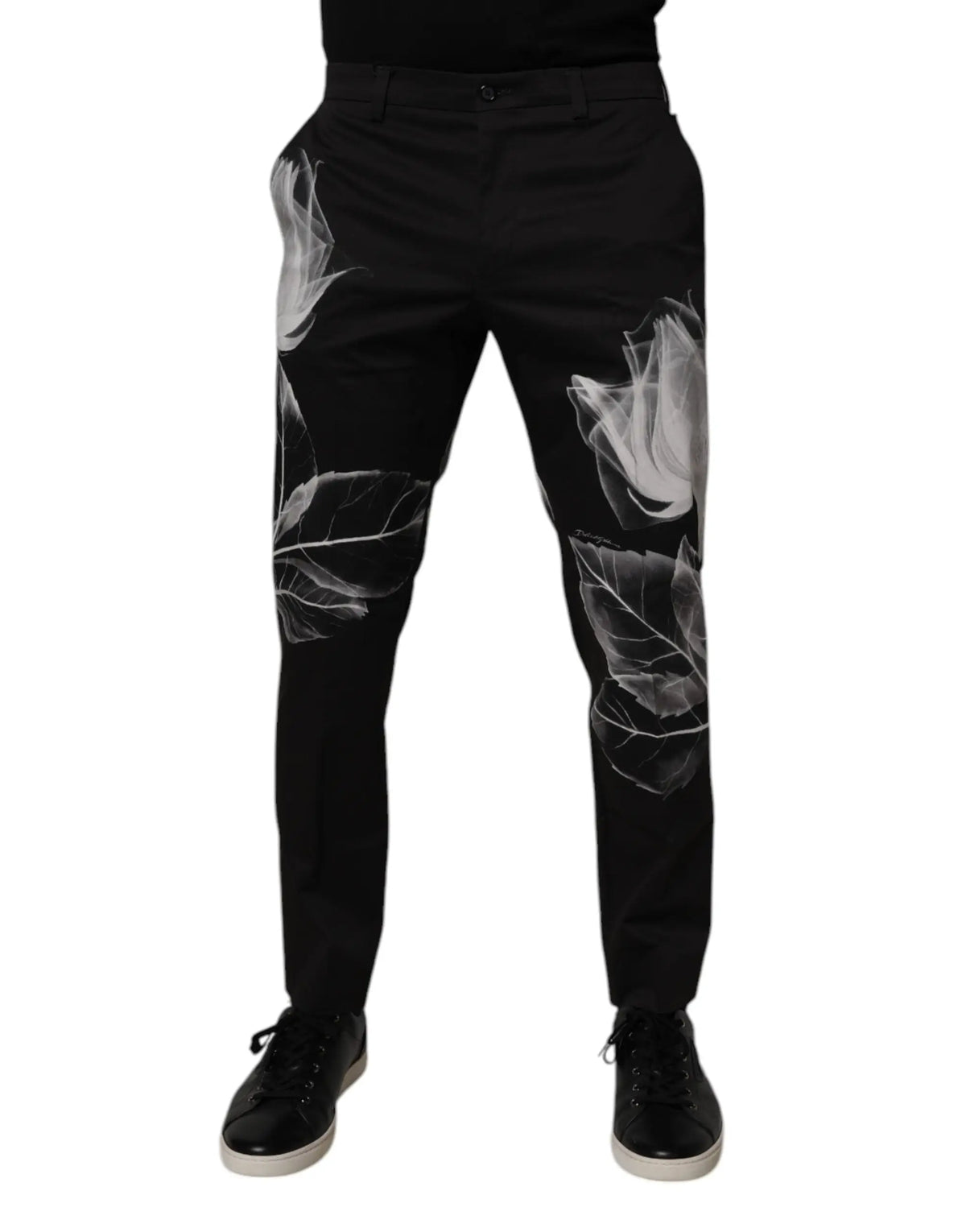 Pantalon slim noir en coton dolce & gabbana avec motif floral blanc frappant imprimé sur les jambes