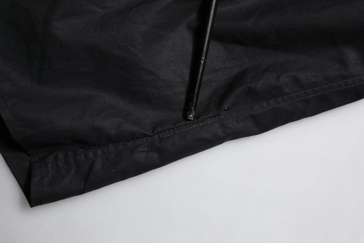 Ombrelle noire en nylon avec tige métallique visible au bord pour la chemise longue en coton noir gold dolce & gabbana
