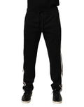 Dolce & Gabbana pantalon jogging noir en coton avec rayures blanches sur le côté et ceinture à cordon