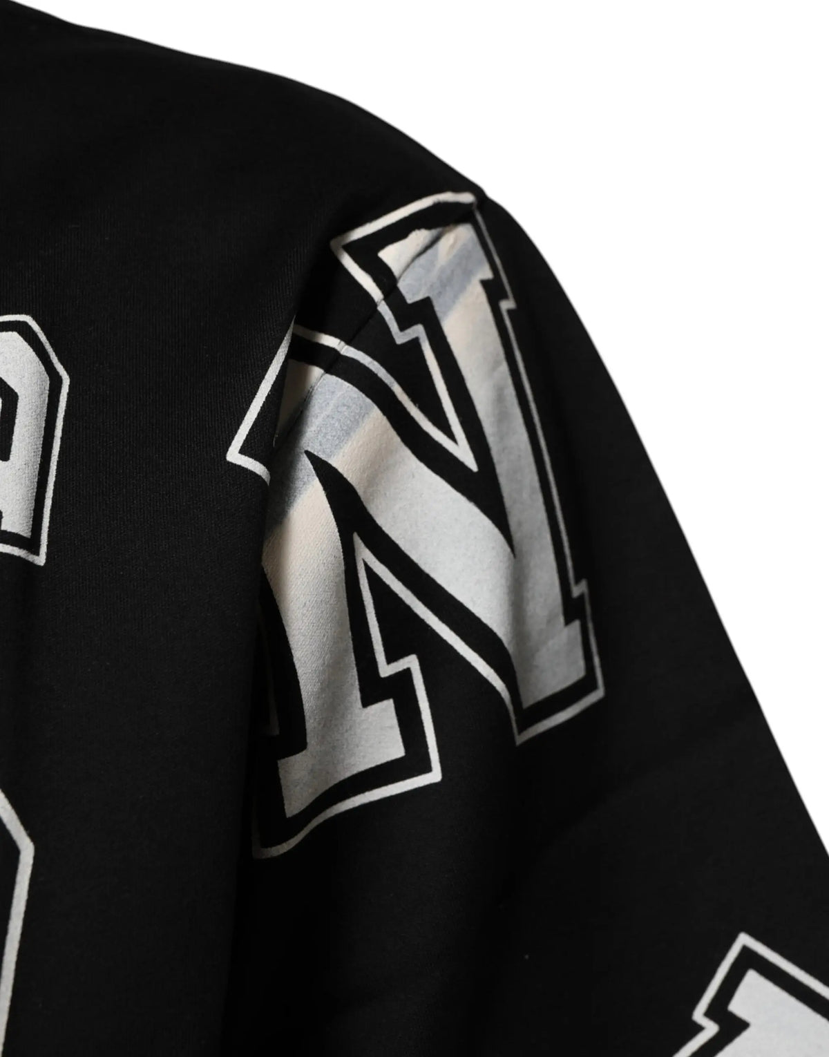 Sweatshirt noir à manches longues en coton dolce & gabbana avec inscription blanche et argentée sur l’épaule