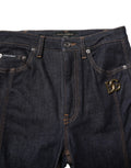 Jean bootcut en coton noir dolce gabbana avec patch logo dg doré sur la poche avant droite en denim bleu foncé