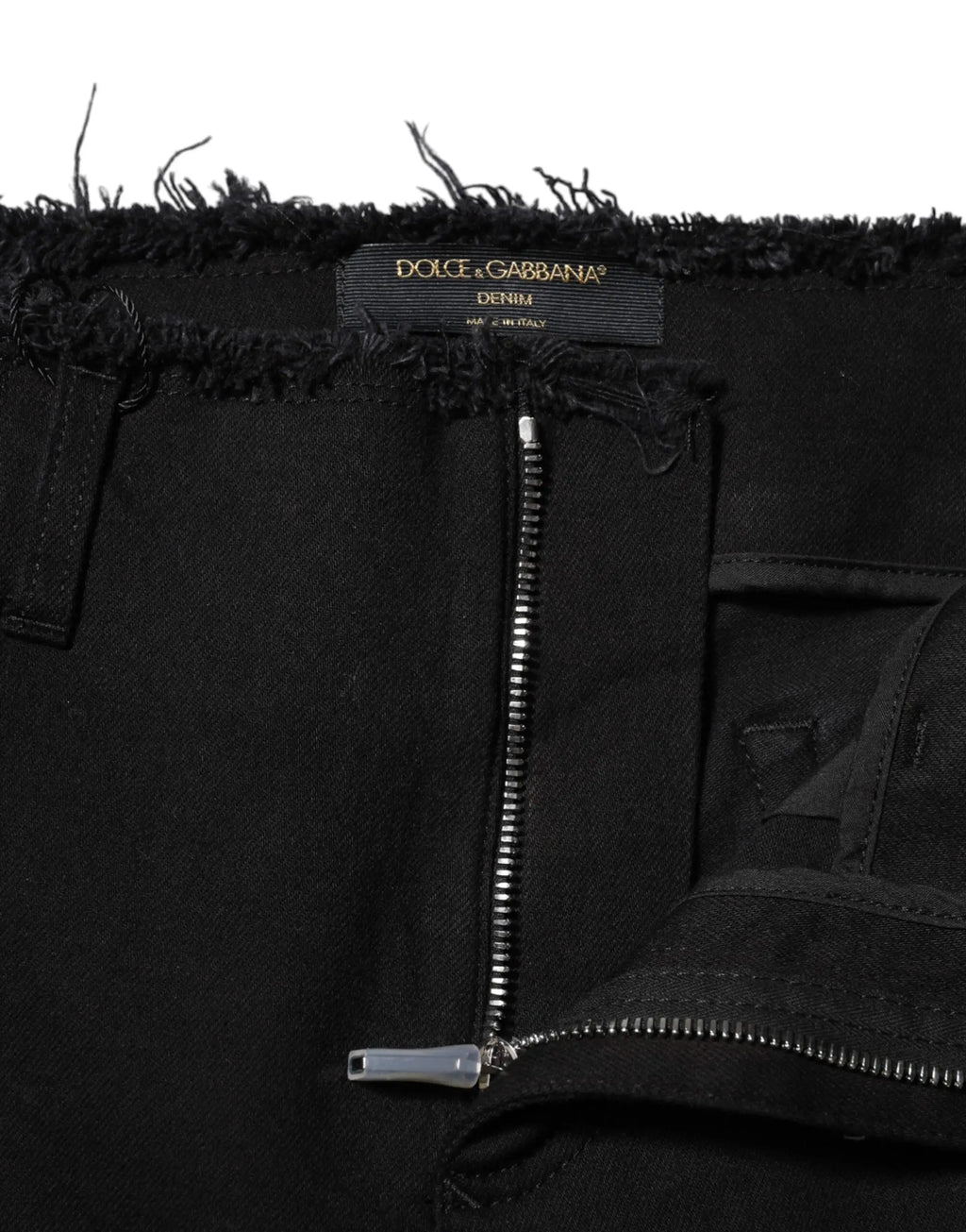 Dolce & gabbana jean en denim noir en coton mi taille avec coupe évasée, ourlet effiloché et fermeture éclair argentée