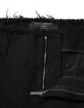 Dolce & gabbana jean en denim noir en coton mi taille avec coupe évasée, ourlet effiloché et fermeture éclair argentée