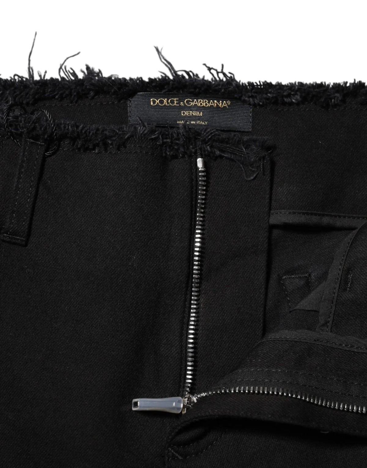 Dolce & gabbana jean en denim noir en coton mi taille avec coupe évasée, ourlet effiloché et fermeture éclair argentée