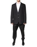 Blazer noir en coton dolce gabbana à deux boutons avec poches à rabat porté sur chemise blanche