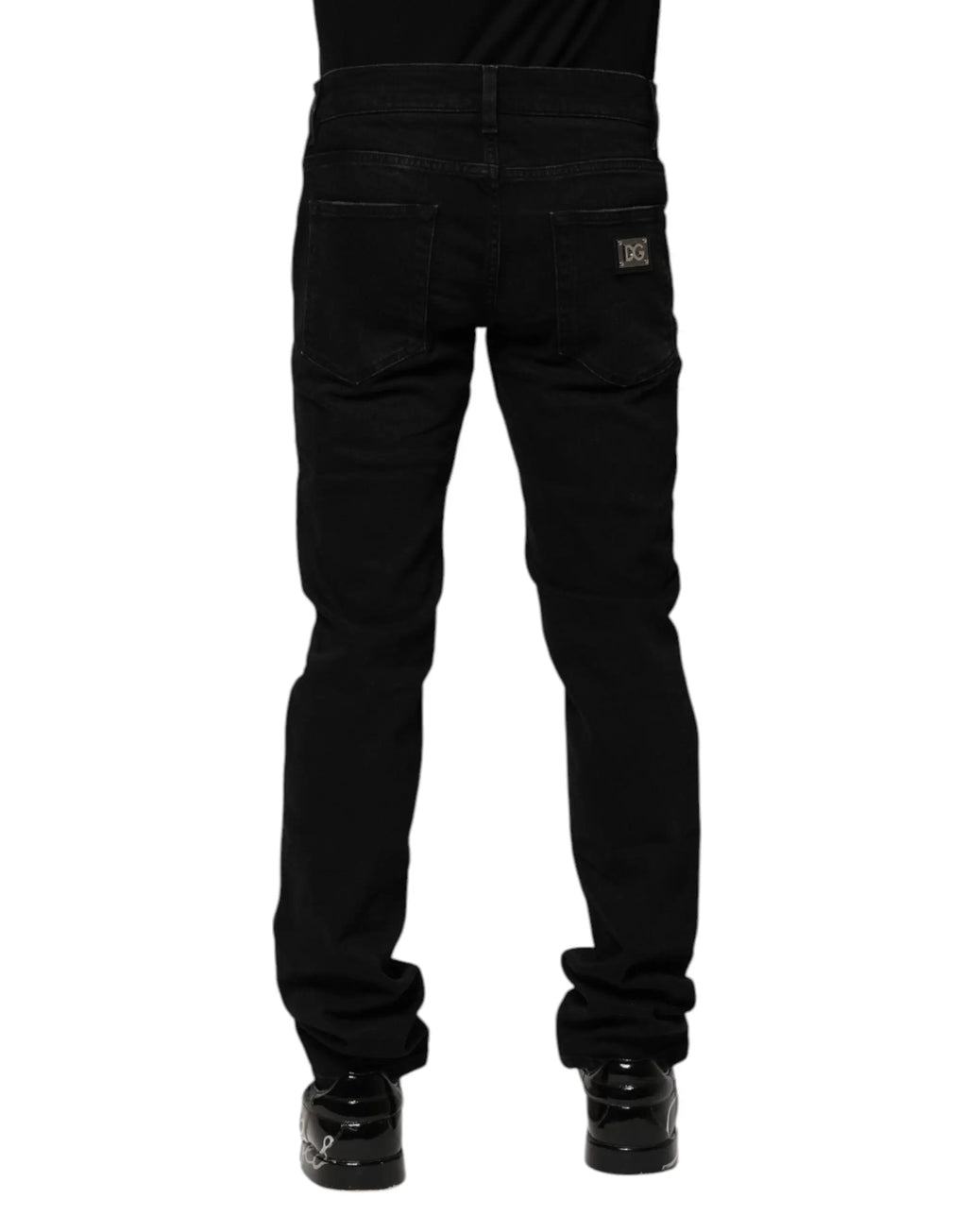 Jean slim noir en denim coton dolce & gabbana avec légère déchirure aux cuisses et patch marque au dos droit