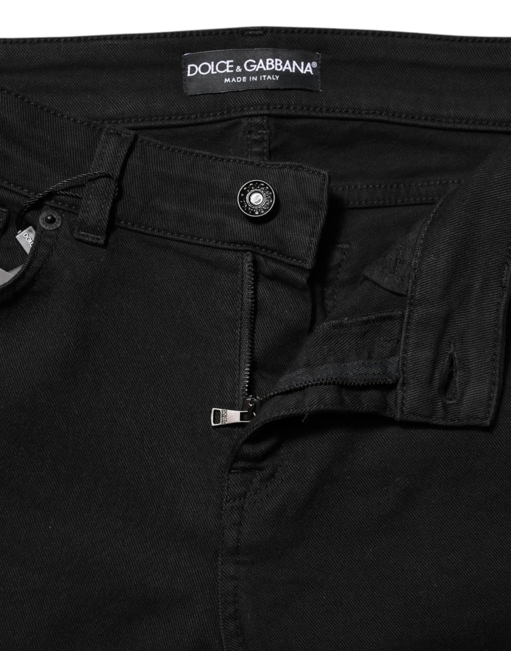 Jean en denim noir dolce & gabbana en coton skinny taille mi-haute avec bouton argenté visible