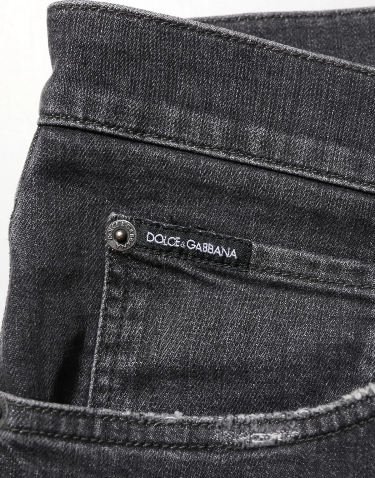 Jean slim noir en coton dolce & gabbana avec délavage subtil et logo cousu à la ceinture