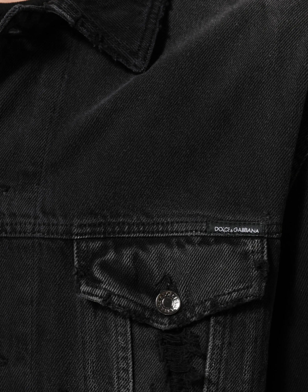Veste en jean noire dolce gabbana en coton stretch avec texture délavée subtile et bords effilochés