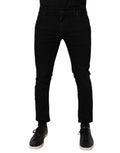 Jean slim noir en denim stretch coton pour homme de dolce & gabbana avec cinq poches classiques et légères décolorations aux cuisses