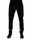 Jean slim en denim noir pour homme dolce & gabbana en coton stretch avec revers roulés