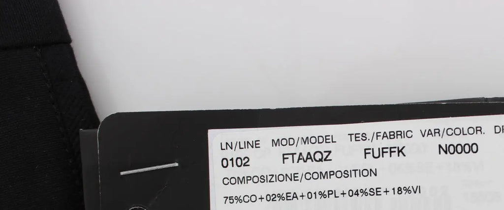 Étiquette en tissu noir avec texte blanc indiquant la composition et spécifications du pantalon capri torero en coton stretch noir dolce & gabbana