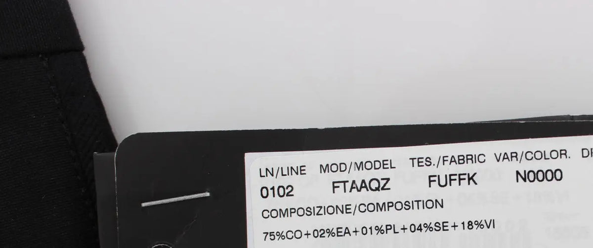 Étiquette en tissu noir avec texte blanc indiquant la composition et spécifications du pantalon capri torero en coton stretch noir dolce & gabbana