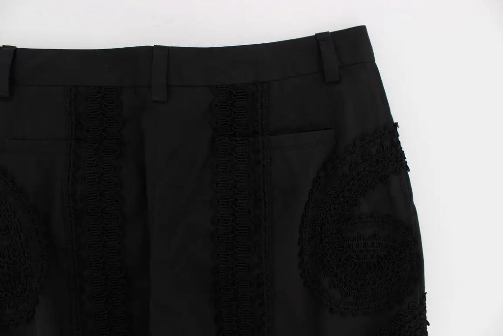 Pantalon capri torero en coton stretch noir dolce et gabbana avec dentelle noire sur les côtés et patch brodé sur la cuisse