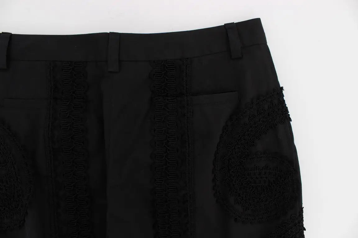 Pantalon capri torero en coton stretch noir dolce et gabbana avec dentelle noire sur les côtés et patch brodé sur la cuisse