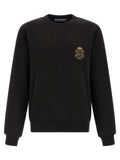Sweatshirt noir dolce gabbana en coton avec écusson brodé or sur la poitrine gauche