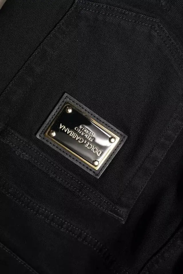 Jean skinny déchiré noir en coton de dolce & gabbana avec patch marque doré rectangulaire embossé milano vue dos