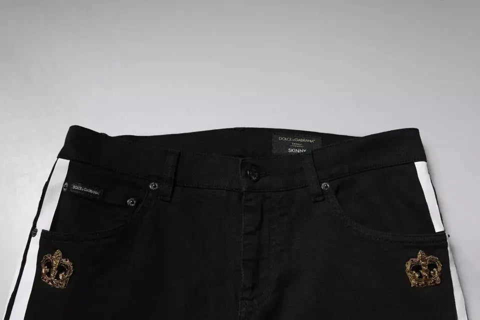 Jean skinny en denim noir dolce & gabbana avec broderie couronne dorée sur les poches avant et rayures blanches sur les coutures