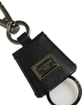 Porte-clés noir en cuir dauphine texturé dolce & gabbana avec plaque logo en métal argenté et anneau circulaire