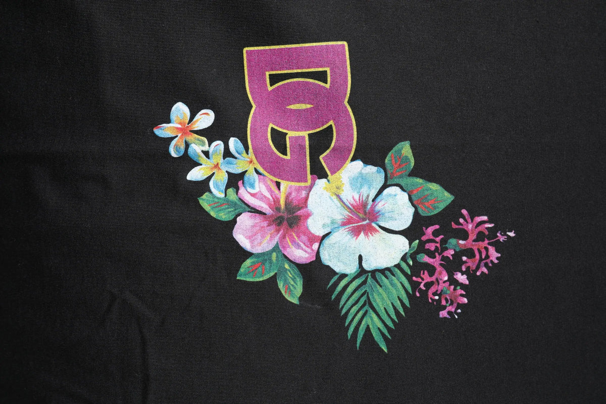 Dolce & gabbana t shirt noir en coton avec imprimé floral vibrant et logo dg violet bordé d or