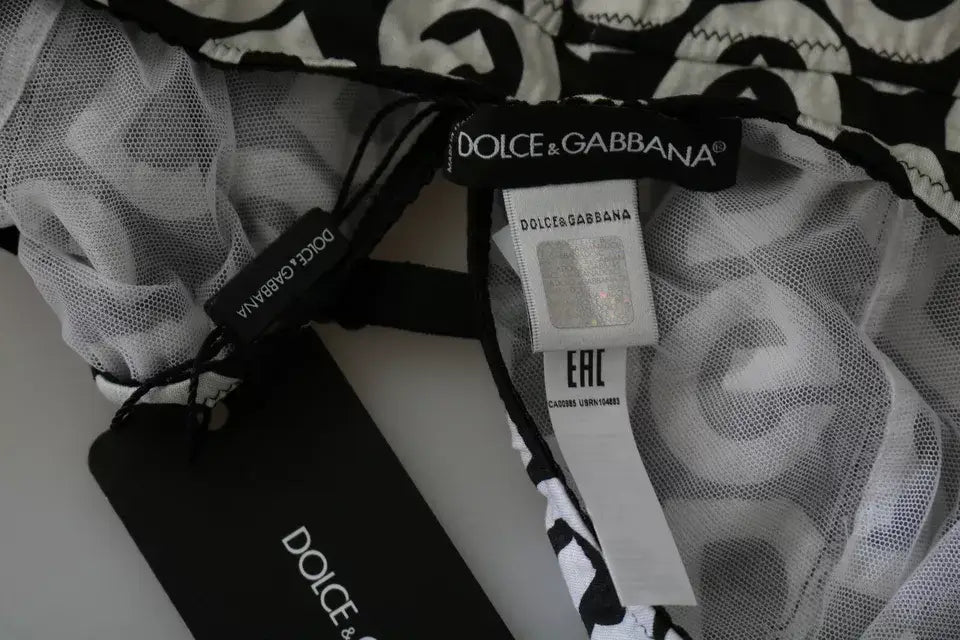 Étiquette dolce & gabbana en noir et blanc avec tissu en maille sur la partie arrière du maillot de bain noir sans manches dg mania