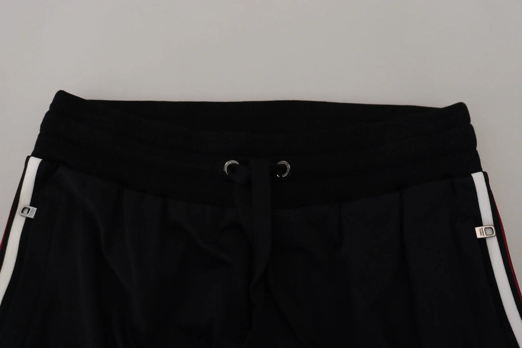 Pantalon de jogging pour homme dolce & gabbana noir avec rayures blanches latérales et œillets métalliques argentés