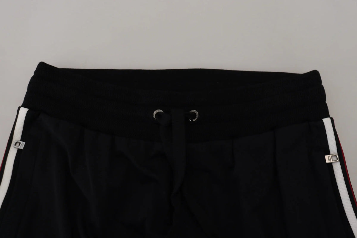 Pantalon de jogging pour homme dolce & gabbana noir avec rayures blanches latérales et œillets métalliques argentés