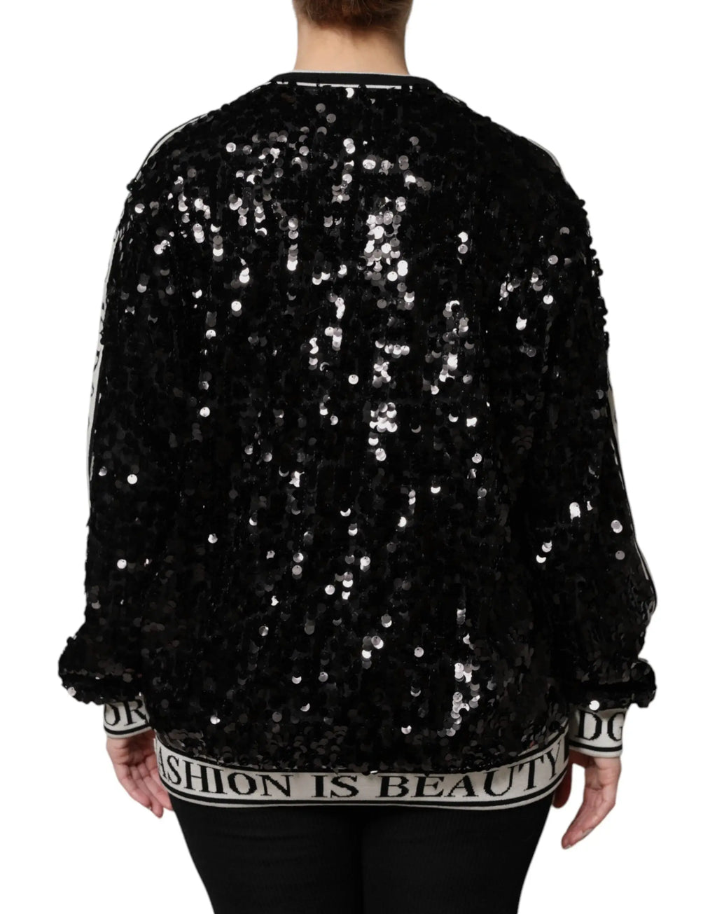 Dolce & Gabbana pull noir en sequins avec bordure en lettres blanches fashion is beauty aux poignets et à la taille