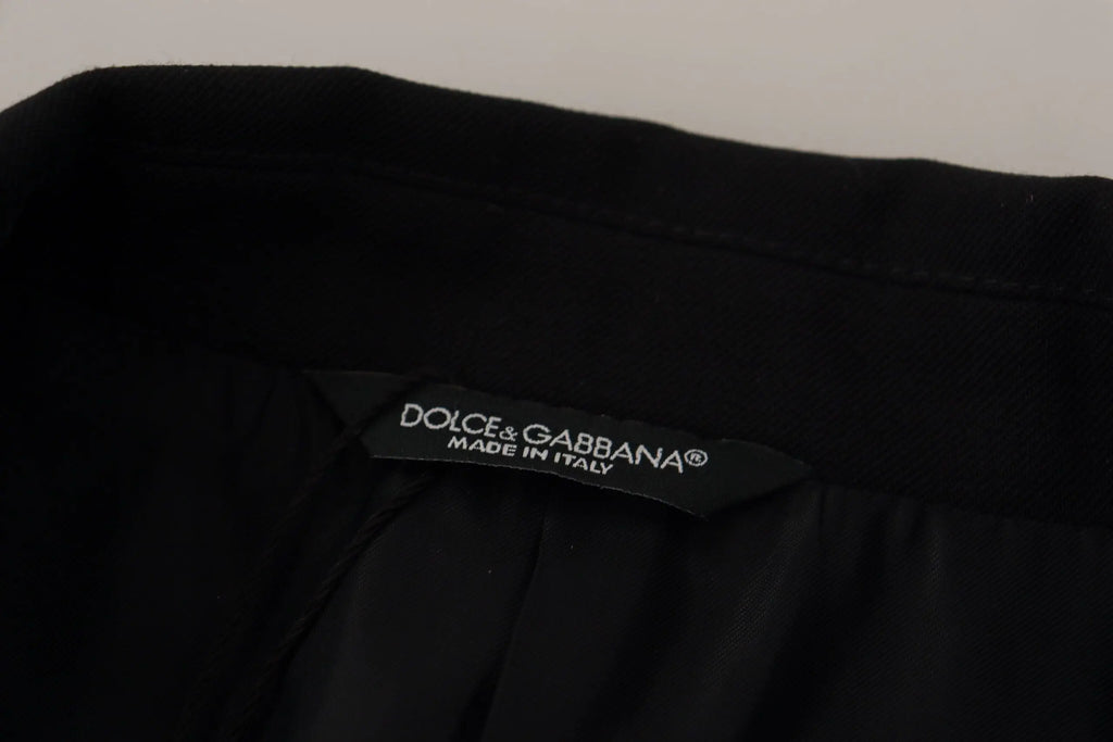 Étiquette noire dolce & gabbana avec texte blanc made in italy sur manteau blazer noir croisé en laine