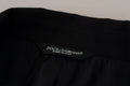 Étiquette noire dolce & gabbana avec texte blanc made in italy sur manteau blazer noir croisé en laine