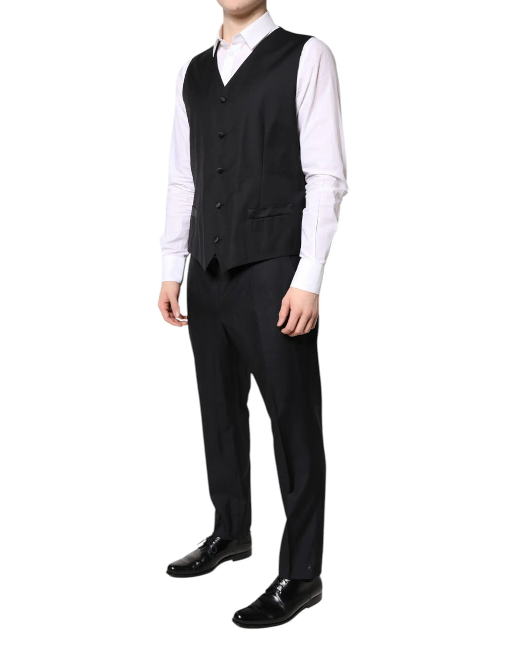 Dolce & gabbana gilet noir tailored avec cinq boutons et un léger brillant porté sur une chemise blanche