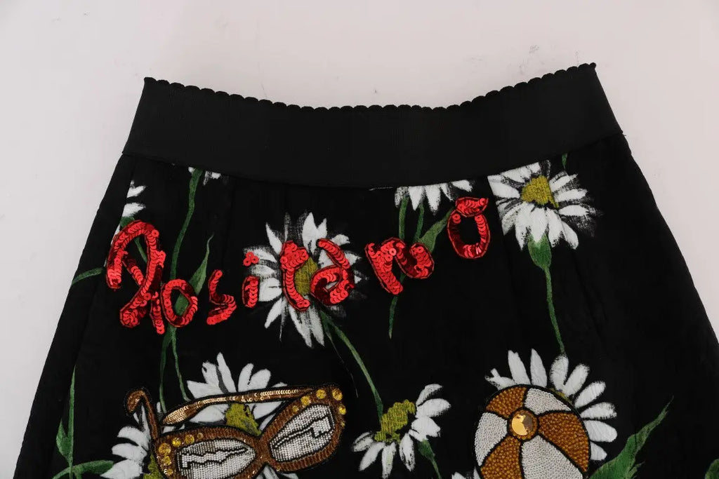 Dolce & gabbana jupe noire en brocart avec motif floral de marguerites blanches et lettrage rosita en sequins rouges