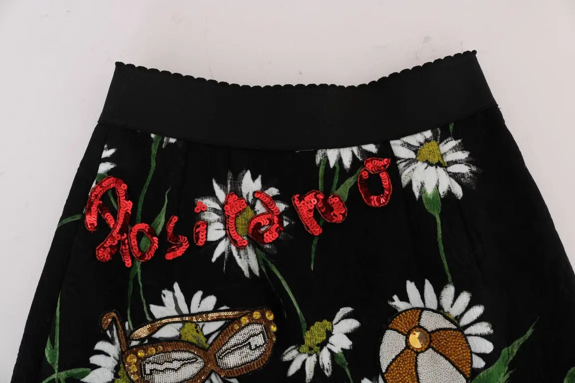 Dolce & gabbana jupe noire en brocart avec motif floral de marguerites blanches et lettrage rosita en sequins rouges