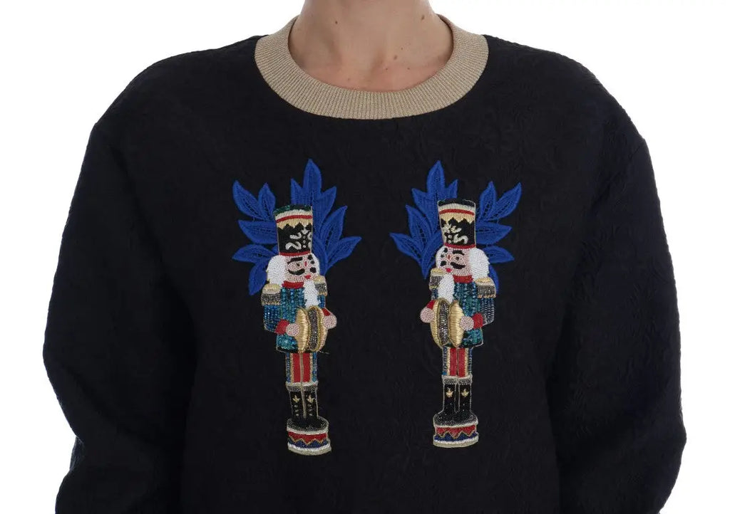 Pull noir dolce gabbana en brocart avec fermeture éclair orné de deux casse-noisettes brodés aux chapeaux bleus