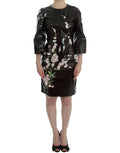 Robe fourreau noire dolce & gabbana en simili cuir brillant avec broderie délicate de fleurs de cerisier roses