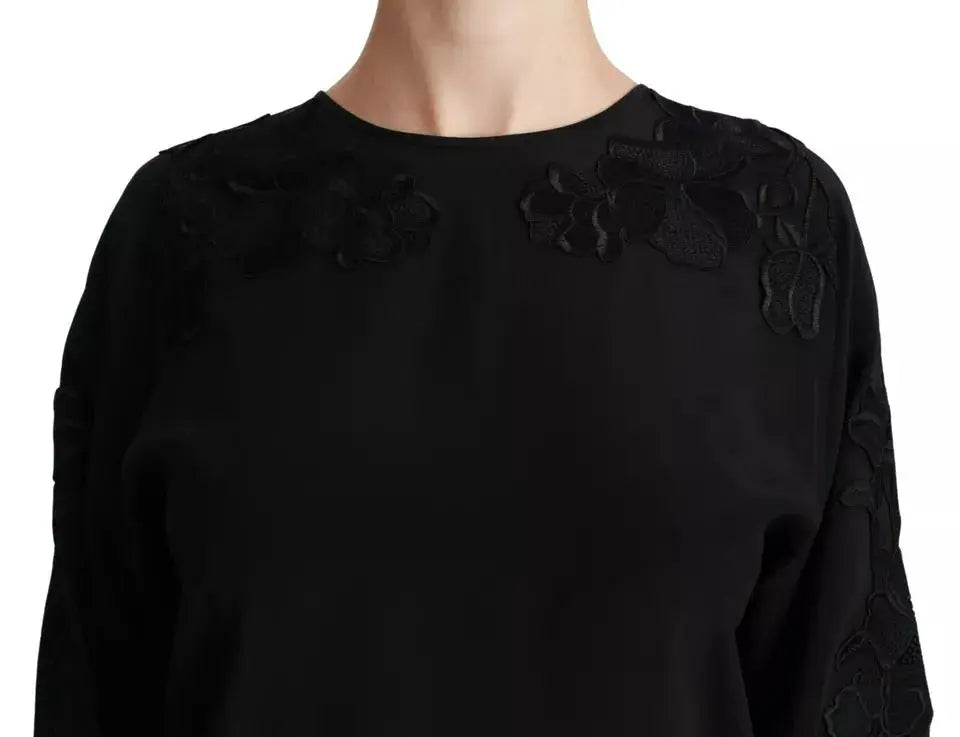 Dolce & Gabbana blouse noire en soie avec appliqué floral détaillé sur les épaules et les manches longues