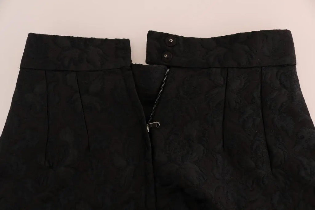 Pantalon noir texturé taille haute avec fermeture éclair et bouton détaillé sous une jupe noire en jacquard floral dolce & gabbana en soie