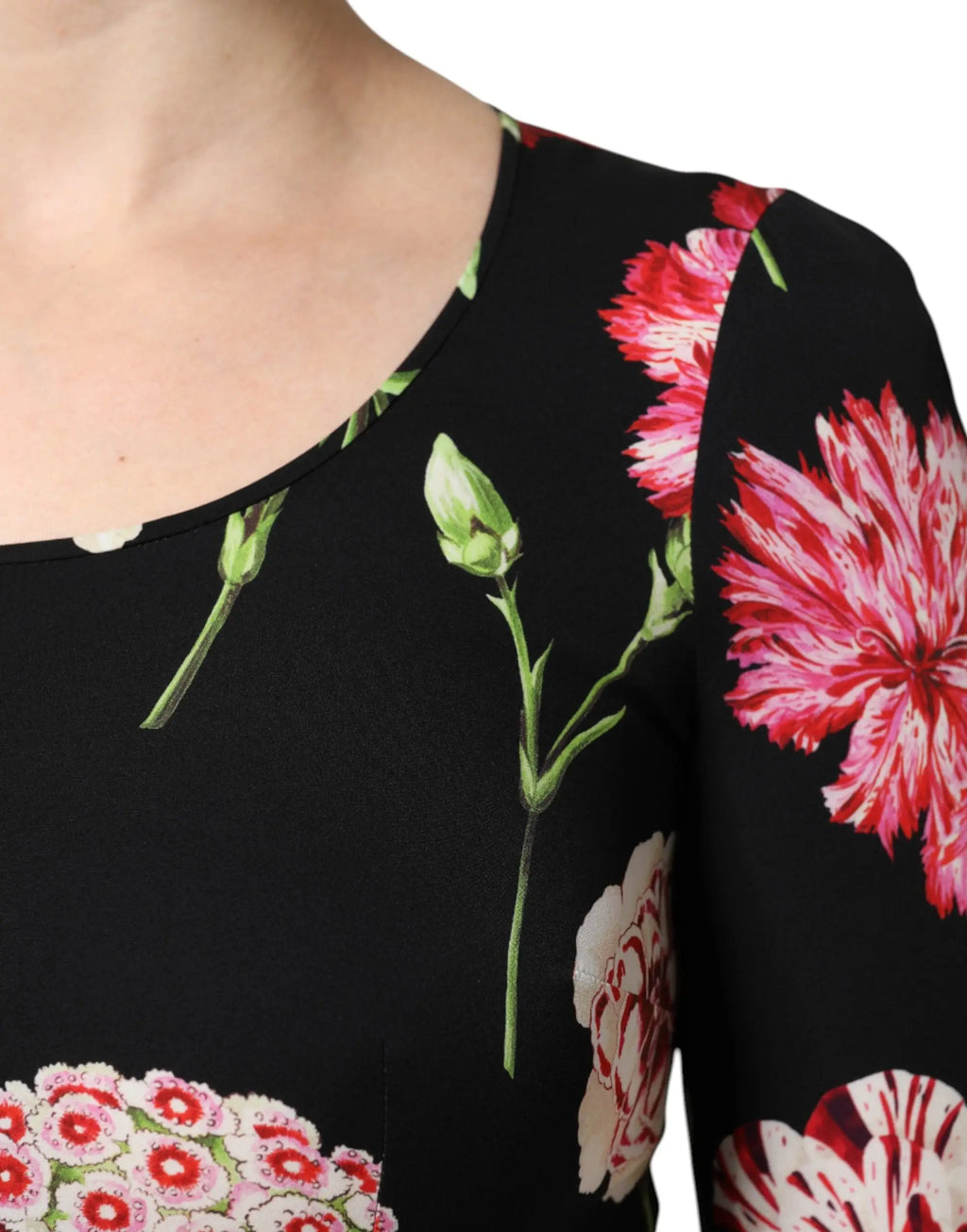 Dolce & Gabbana blouse femme noire à manches longues avec imprimé floral de carnations roses et blanches vibrantes