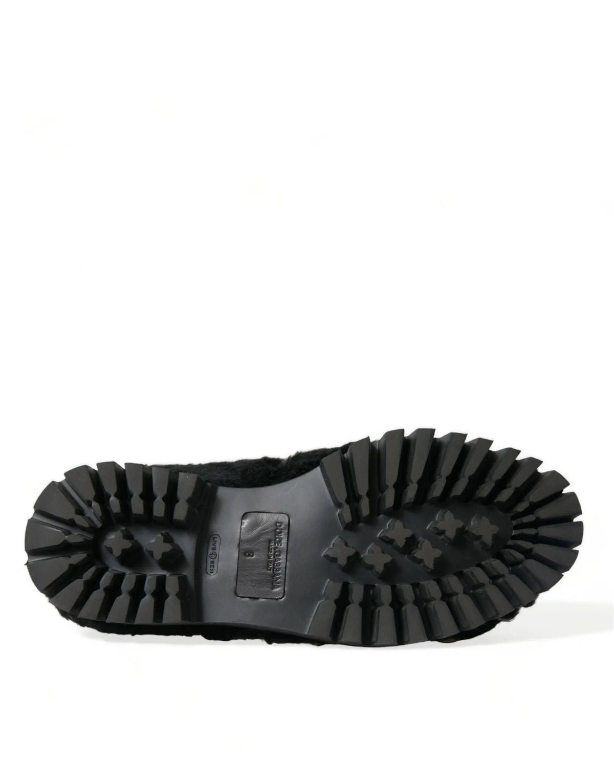 Dessous en caoutchouc noir avec semelle à motif profond et étiquette rectangulaire des slippers dolce & gabbana en cuir et fourrure