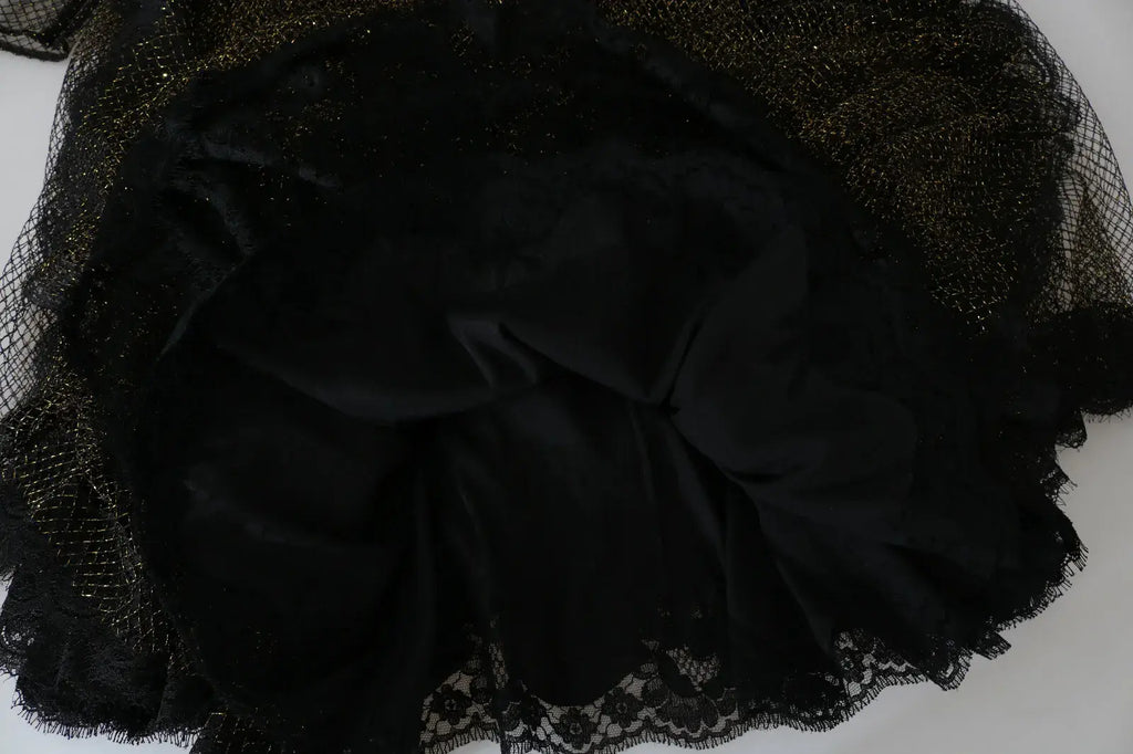 Jupe en velours noir avec superposition en maille pailletée or et bordure en dentelle délicate de dolce gabbana