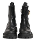 Bottes chelsea en cuir noir dolce et gabbana avec boucle dorée et semelles en caoutchouc épaisses