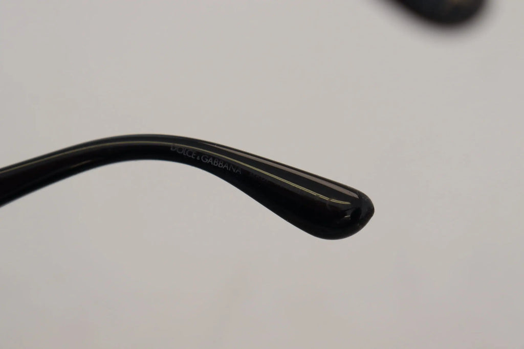 Détail de l’embout de branche en plastique noir brillant des lunettes dolce & gabbana dg4326 papillon pailleté or noir polarisées
