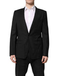 Dolce & Gabbana blazer noir en laine tailleur avec revers crantés et deux poches à rabat dorées