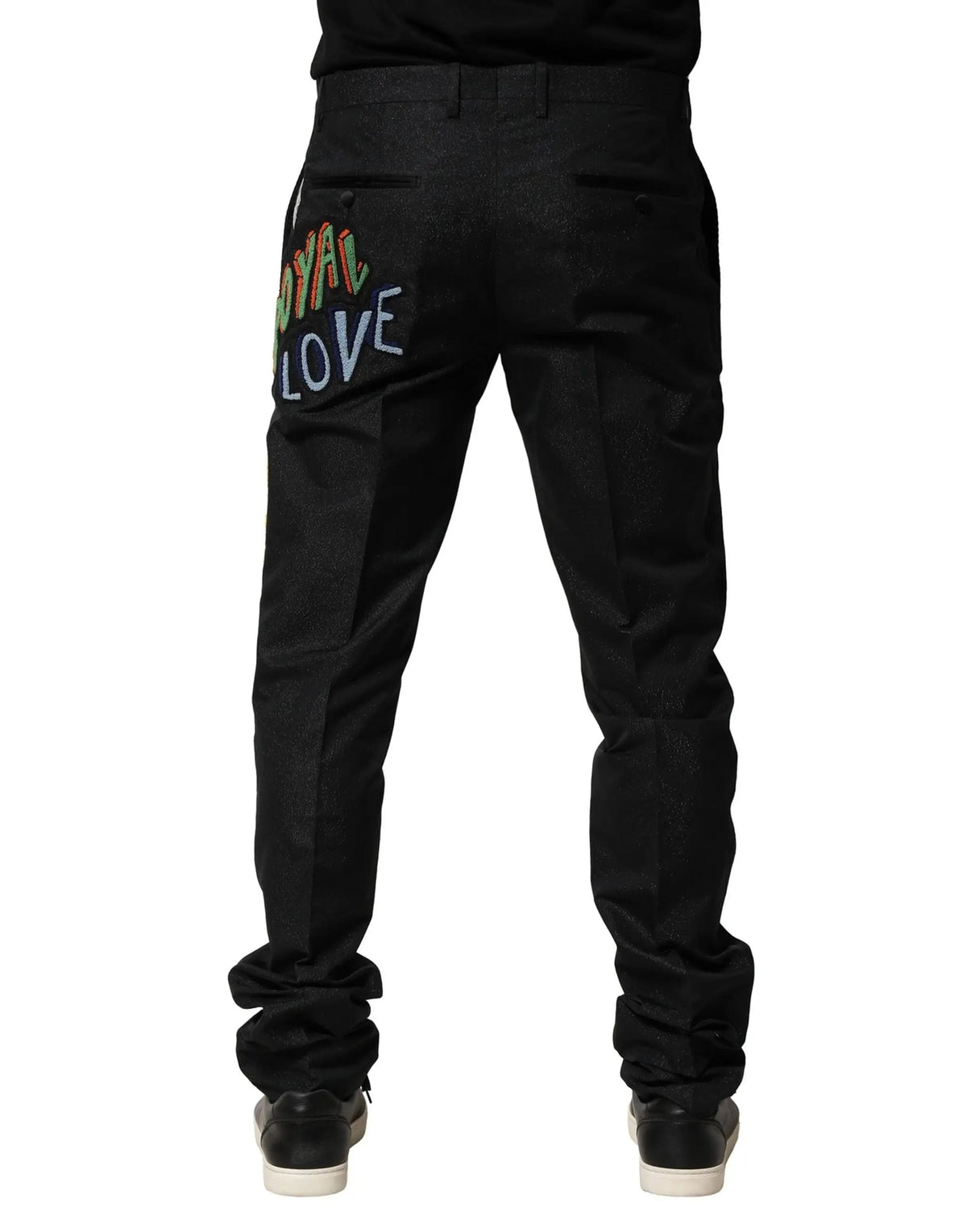 Vue arrière de pantalon homme dolce & gabbana en jean noir avec broderie colorée royal love sur la poche arrière
