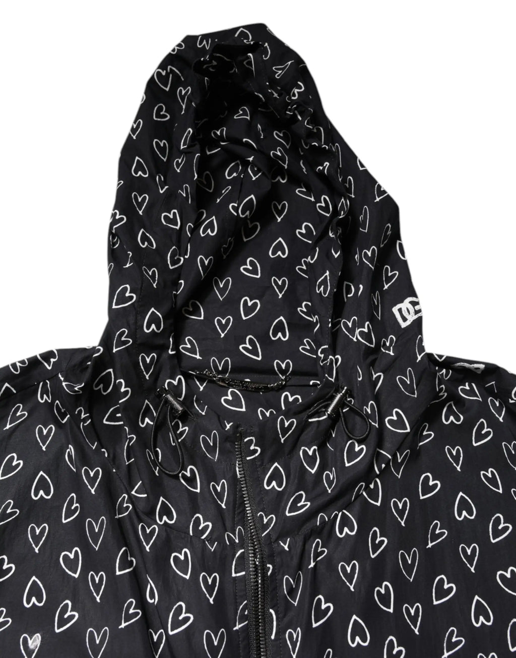 Veste coupe-vent à capuche noire dolce & gabbana avec motif cœur blanc répété et logo dc sur lépaule gauche