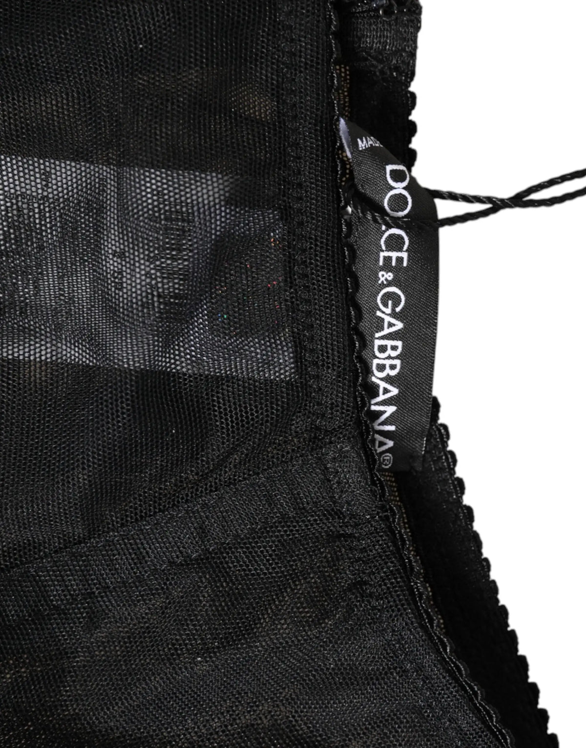 Étiquette noire dolce & gabbana sur vêtement en tissu noir transparent shapewear taille haute en mesh