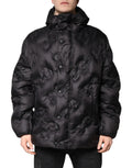 Parka noire dolce gabbana avec capuche en tissu matelassé à motifs floraux subtils et boutons fermoirs pour l’hiver