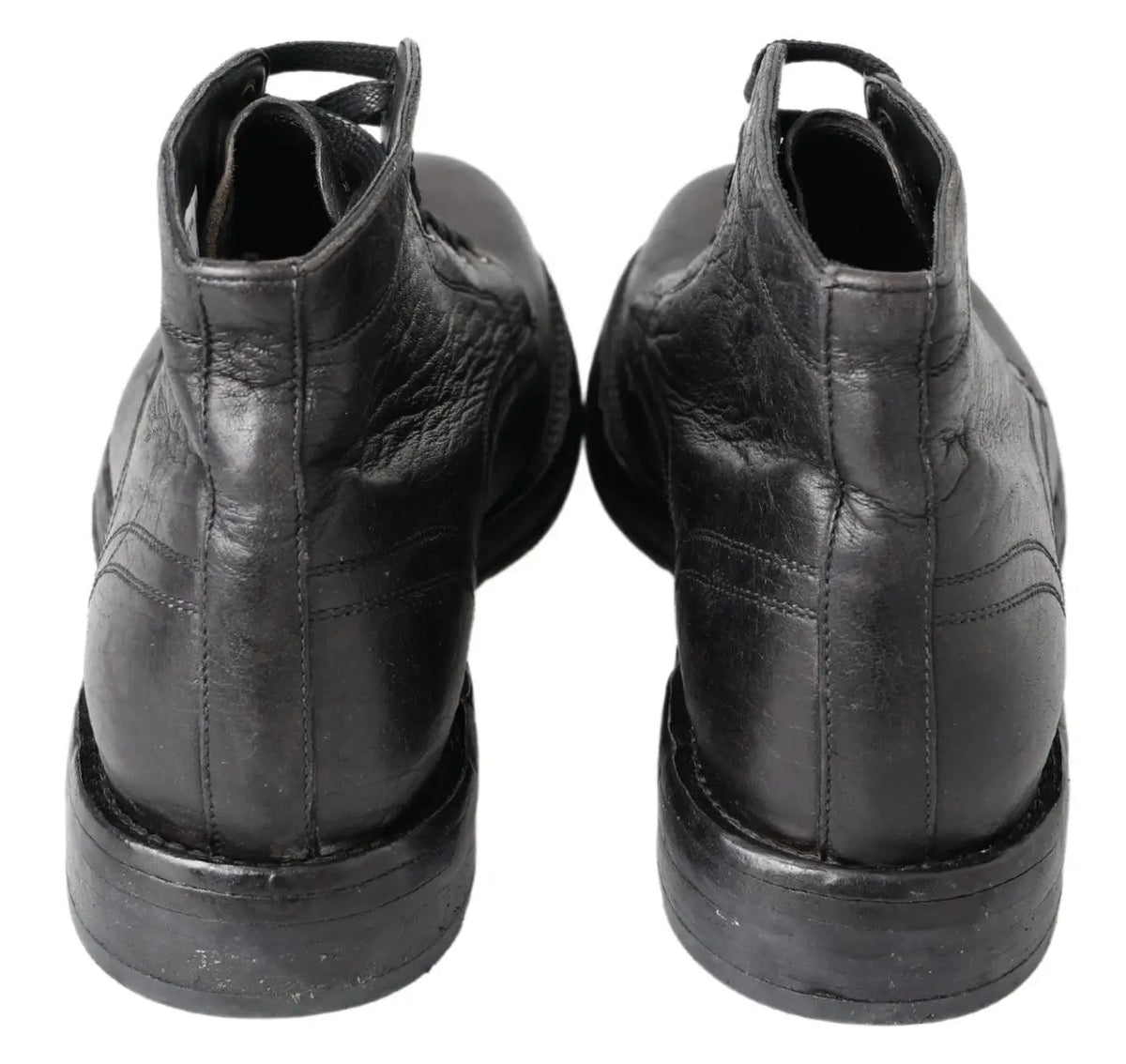 Bottes noires en cuir horse perugino dolce & gabbana avec coutures apparentes et texture légèrement usée