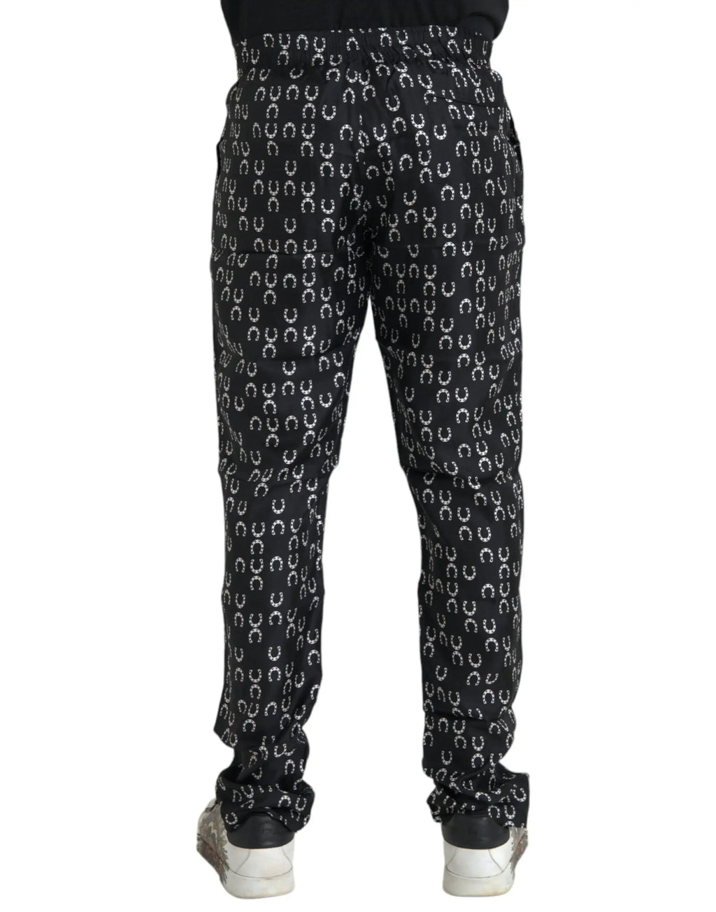 Pantalon en soie noir dolce gabbana avec motif chevaux blancs répétitifs sur tissu jogger